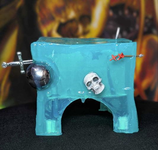 Front view of Coming2U Cube showing its translucent body, embedded pinball, skull, sword and arrows.